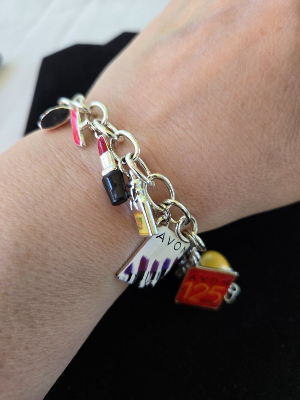 Avon 125th Anniversary Charm Bracelet Silver Tone with 9 Charms